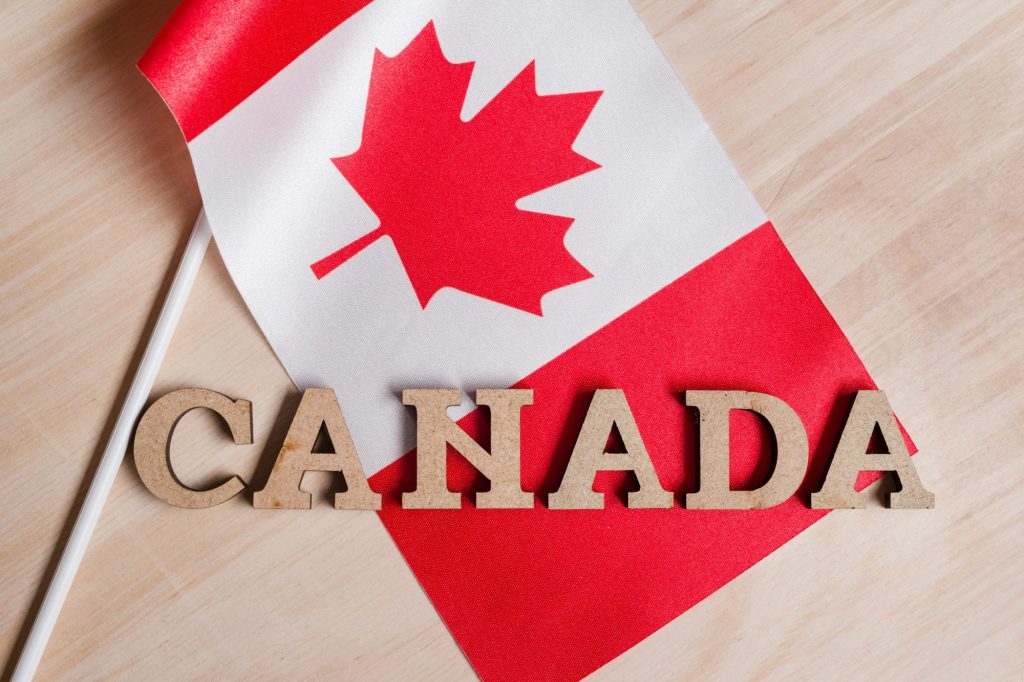 Flag of Canada, the word Canada in wooden abstract letters