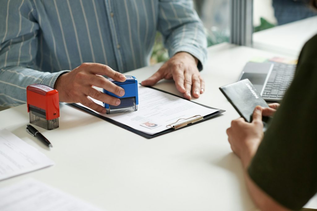 Manager giving visa to client